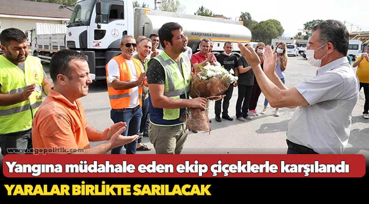 Yangına müdahale eden ekip çiçeklerle karşılandı