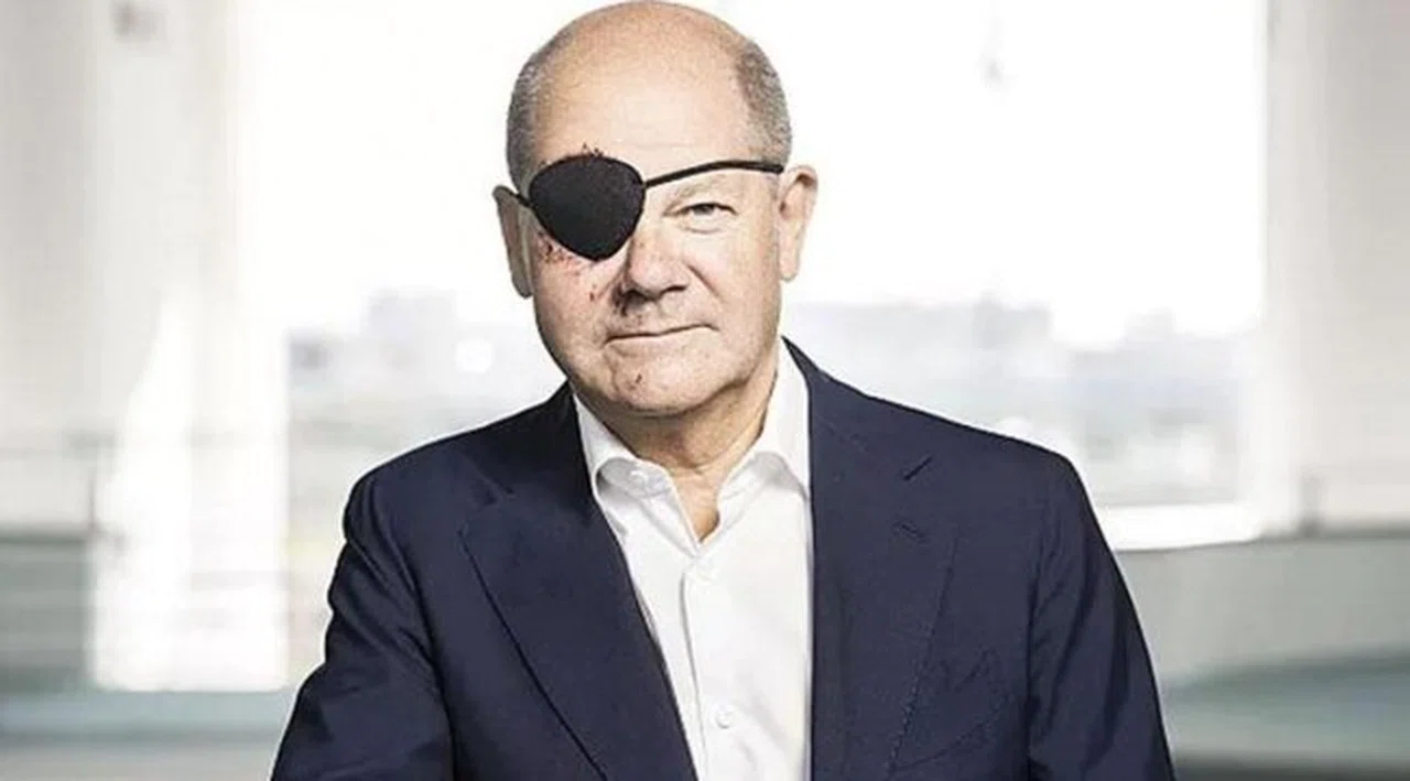 Scholz korsan bantlı fotoğrafını paylaştı