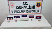 Kuşadası'nda şafak operasyonu: Zehir tacirlerinin evinden cephanelik çıktı