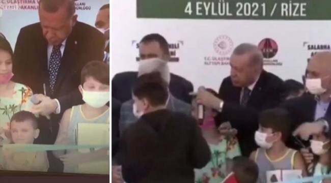 Erdoğan kurdeleyi erken kesen çocuğun kafasına vurdu